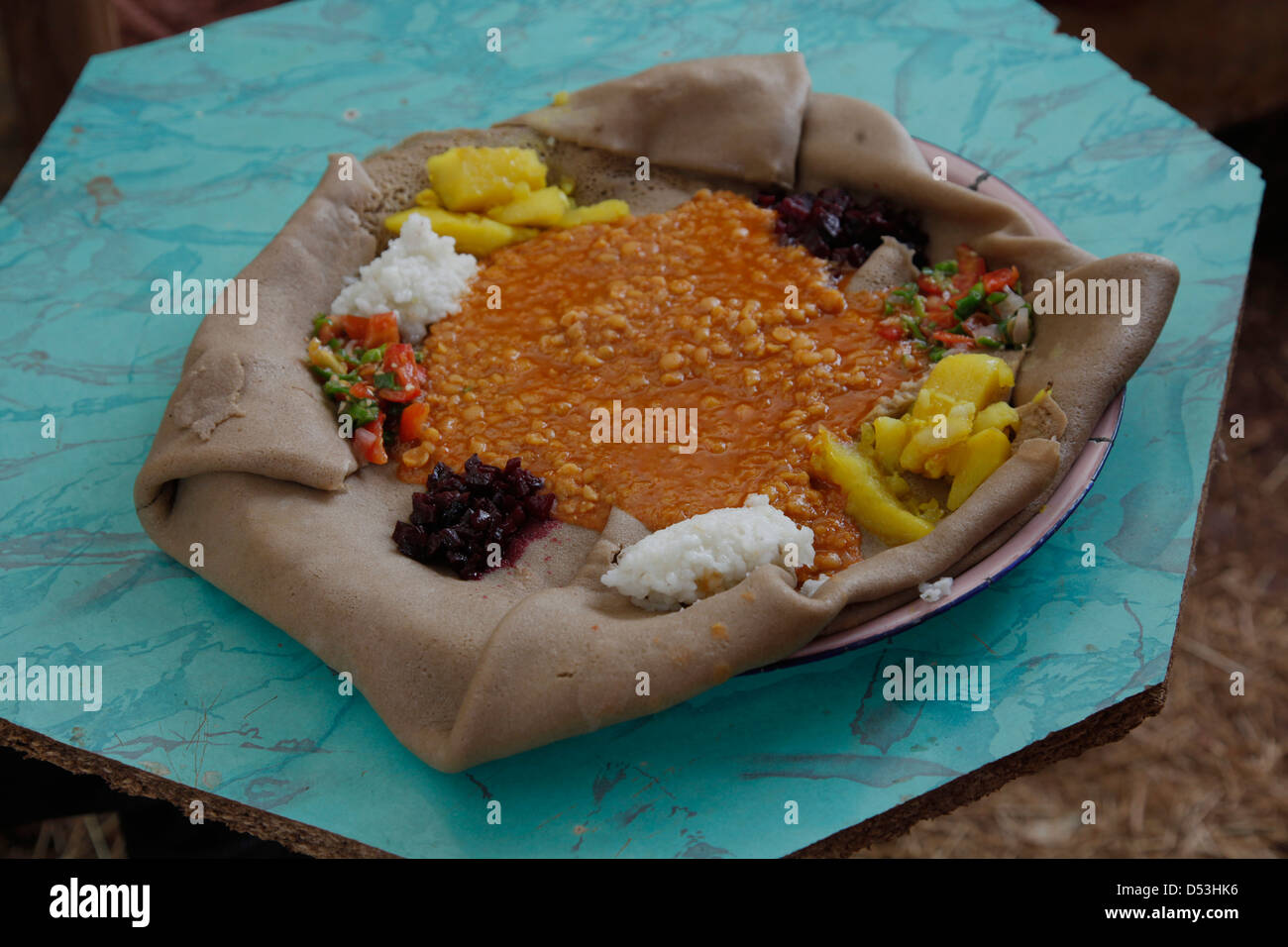 A plate with injera, made of teff flour. it is the national dish and