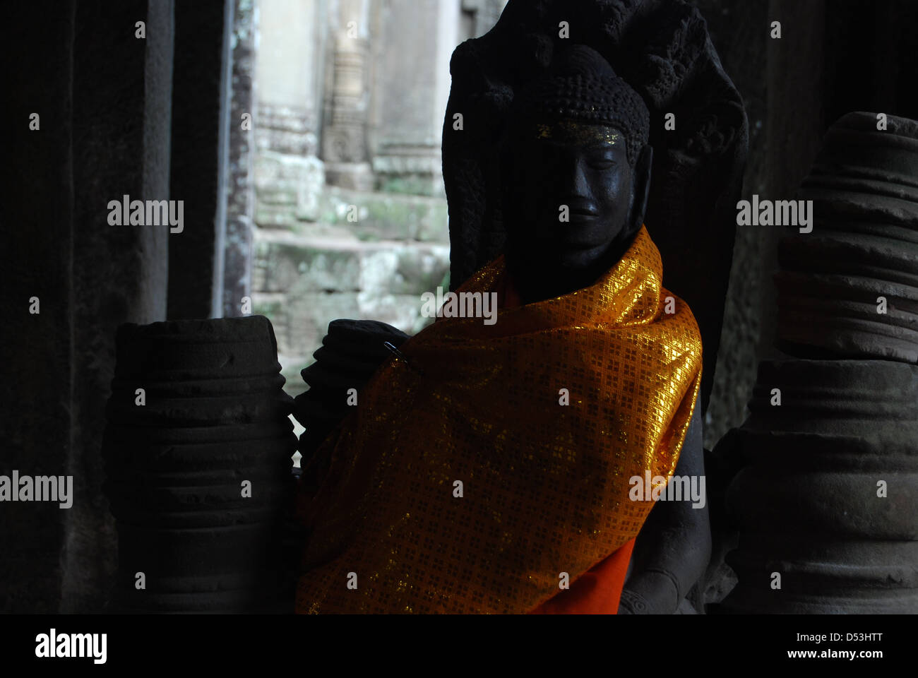 Buddha statue dressed with robes Ankor Wat Temple. Stock Photo