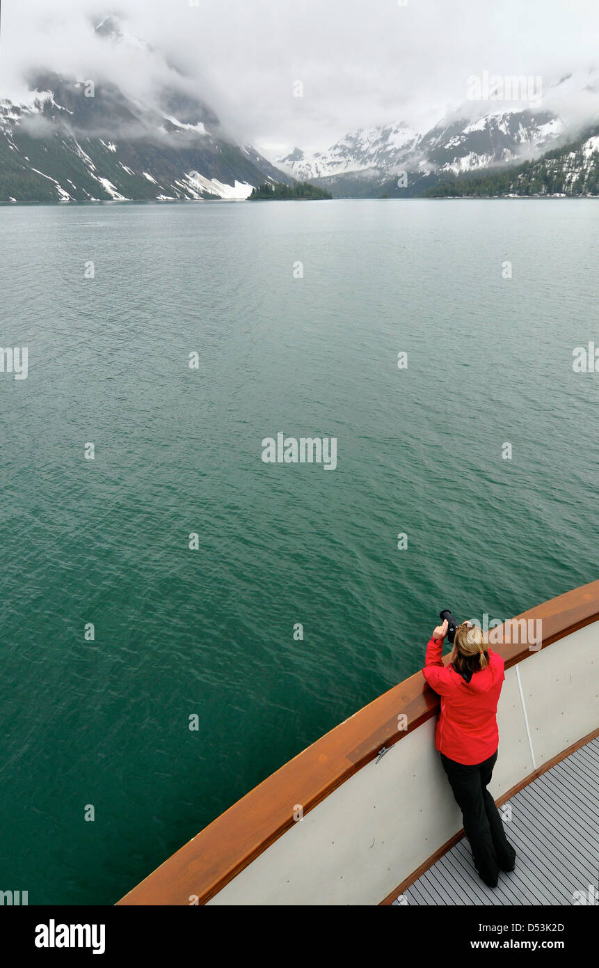 Photographing the scenery from the deck of a small tour boat in Glacier Bay, Alaska. Stock Photo