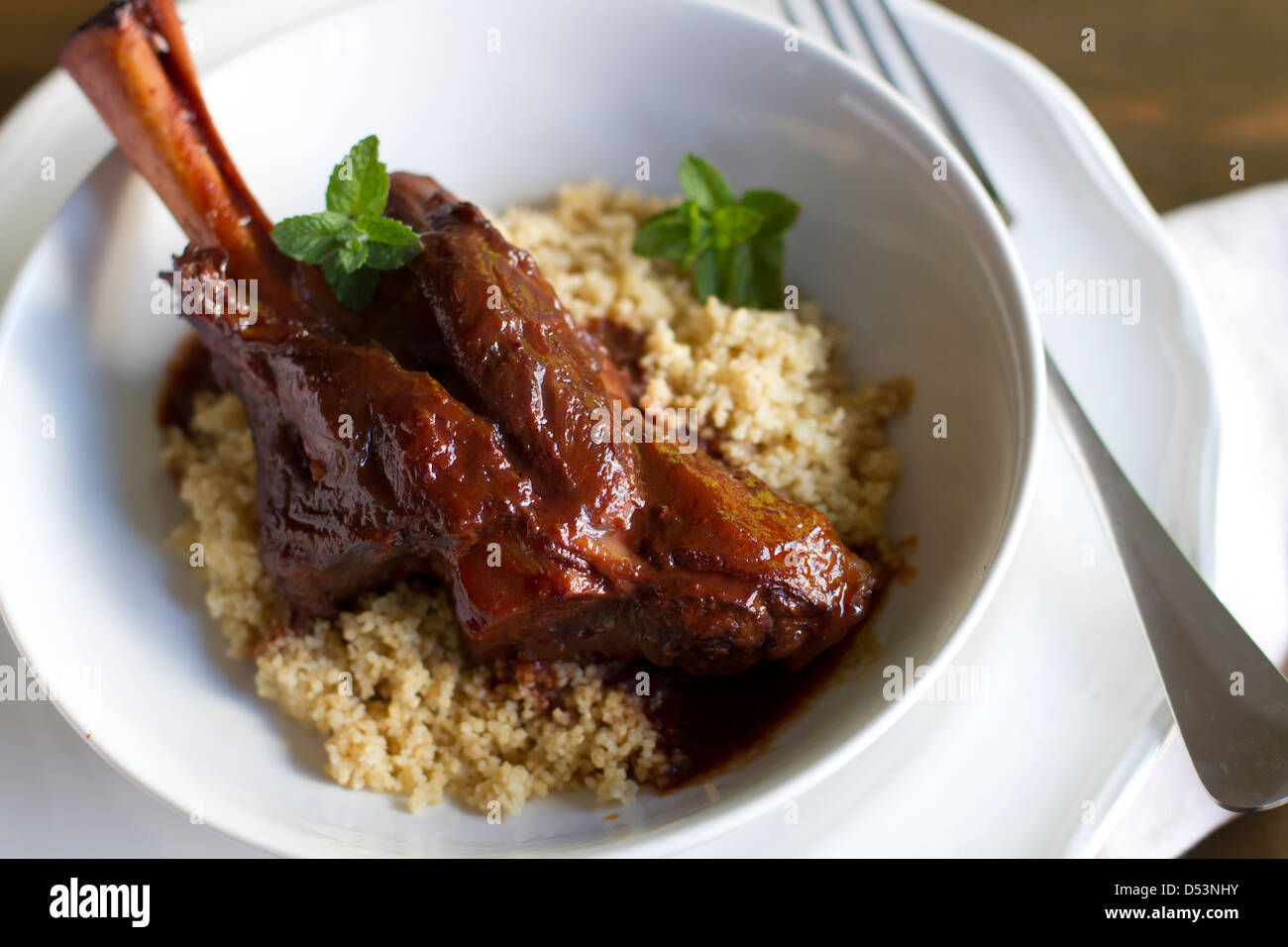 Indian spiced braised lamb shank Stock Photo Alamy