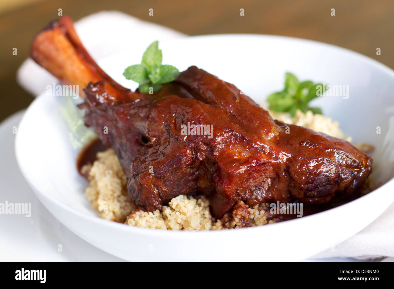 Indian spiced braised lamb shank Stock Photo Alamy