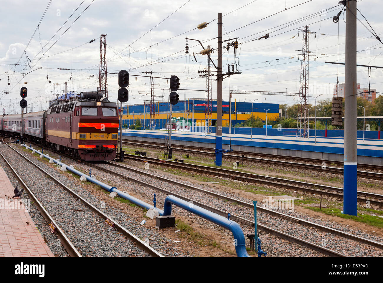 View of the railway track and passenger train in Russia Stock Photo - Alamy