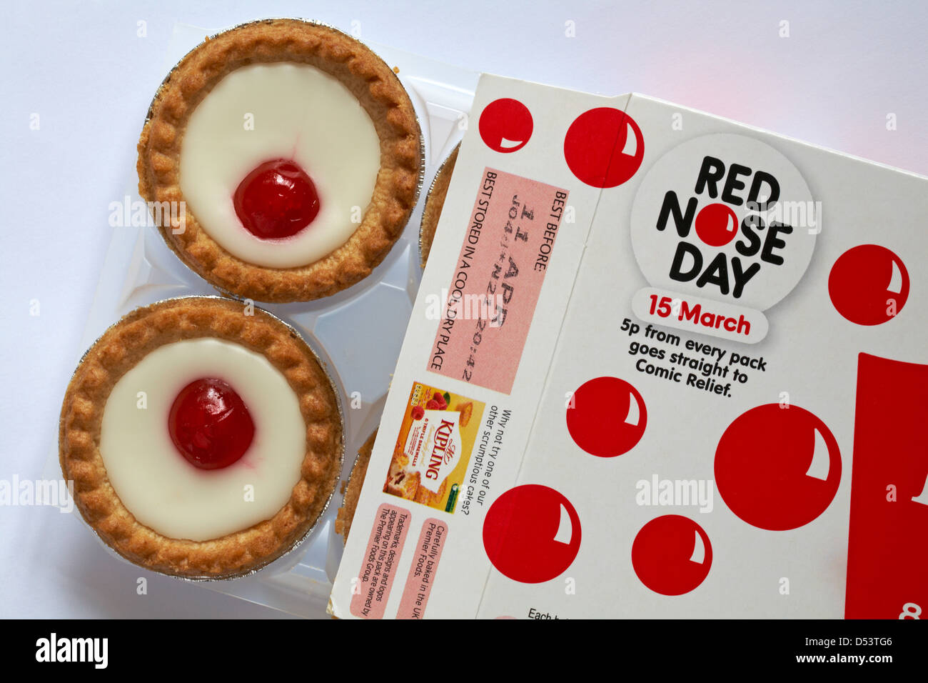 box of Mr Kipling cherry Bakewell tarts undone to show contents - special for Red Nose Day, 5p from each pack goes straight to Comic Relief Stock Photo