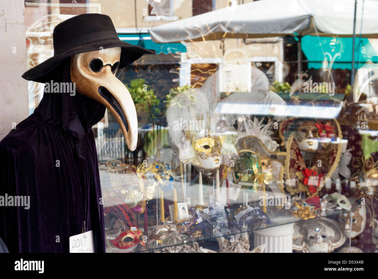 Plague Doctor Mask Costume at a Store Front in Venice Italy Stock Photo