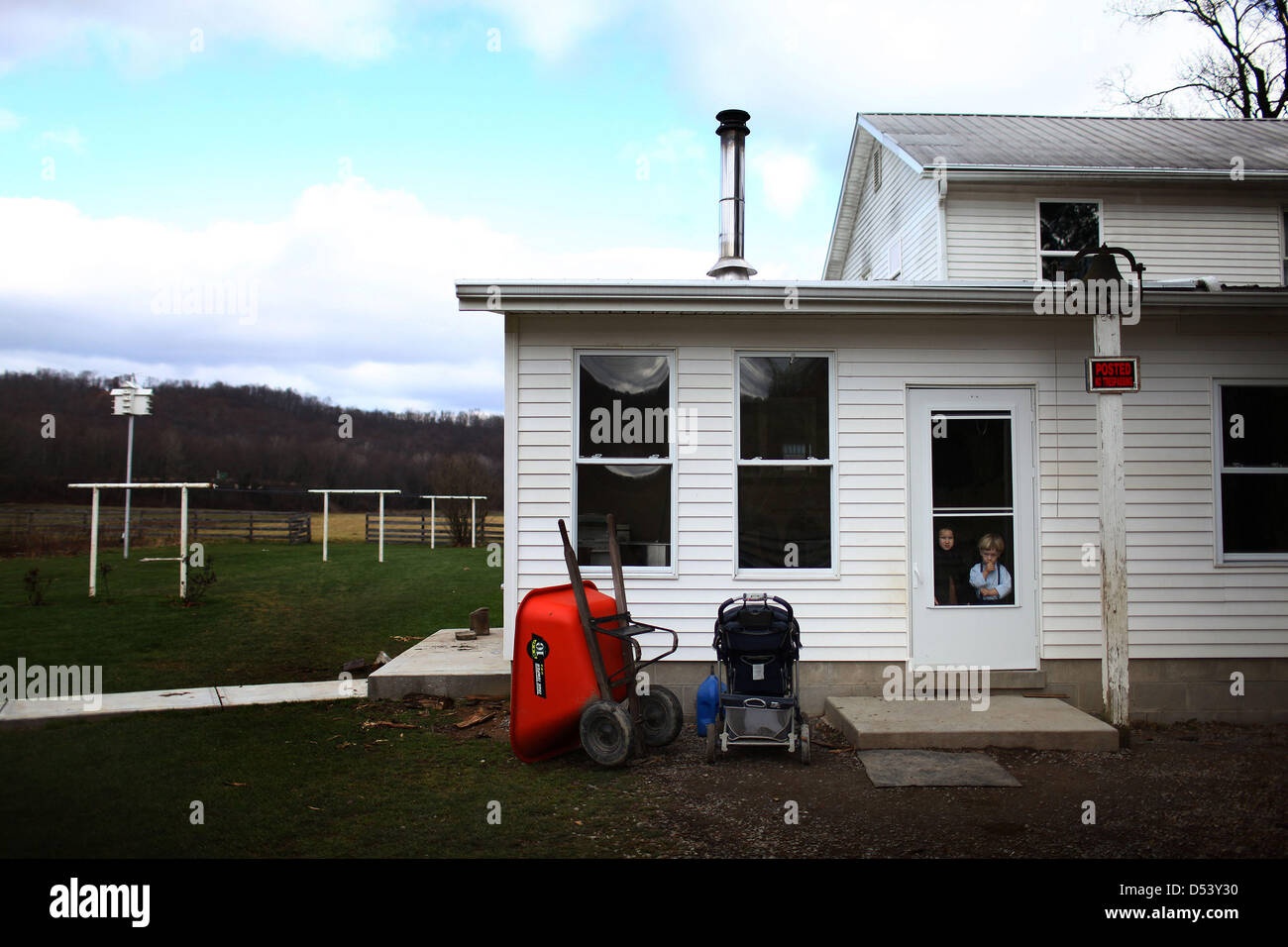 Dec. 5, 2012 Bergholz, Ohio, U.S. Two young Amish children wait for