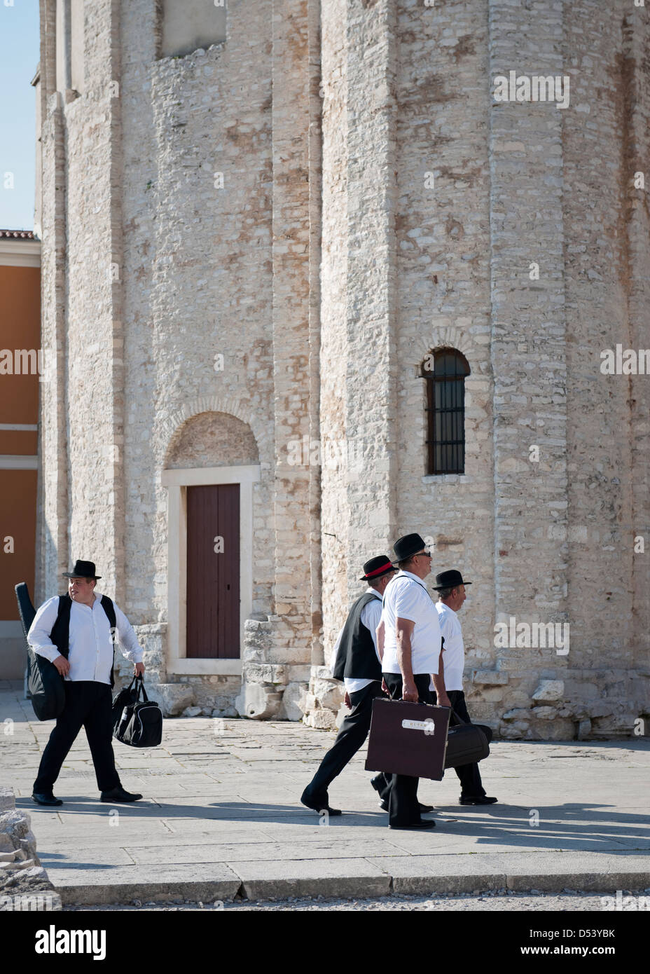 Musicians walking past St Donat's Church,Zadar Stock Photo