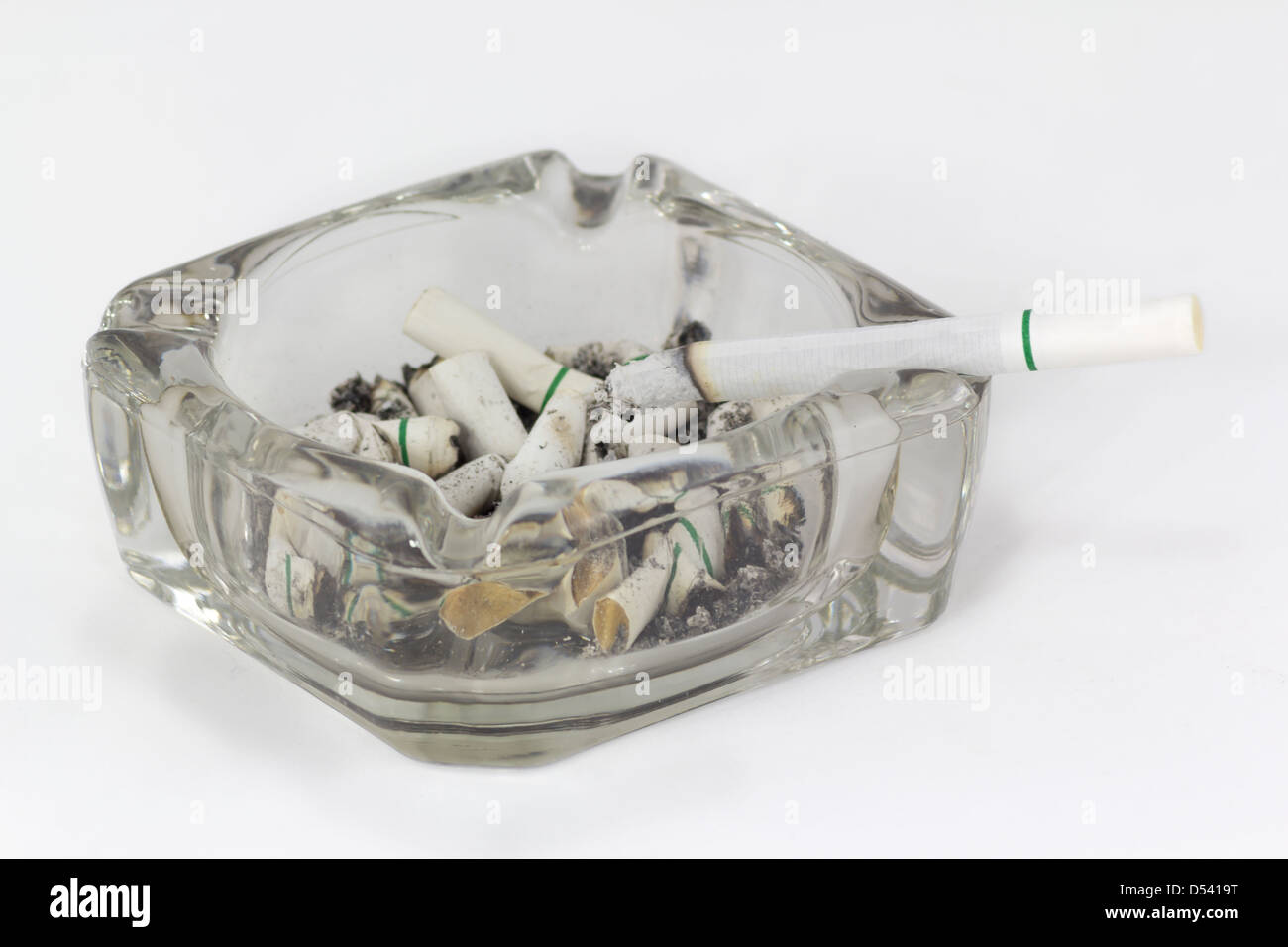 Ashtray and cigarettes on white background Stock Photo