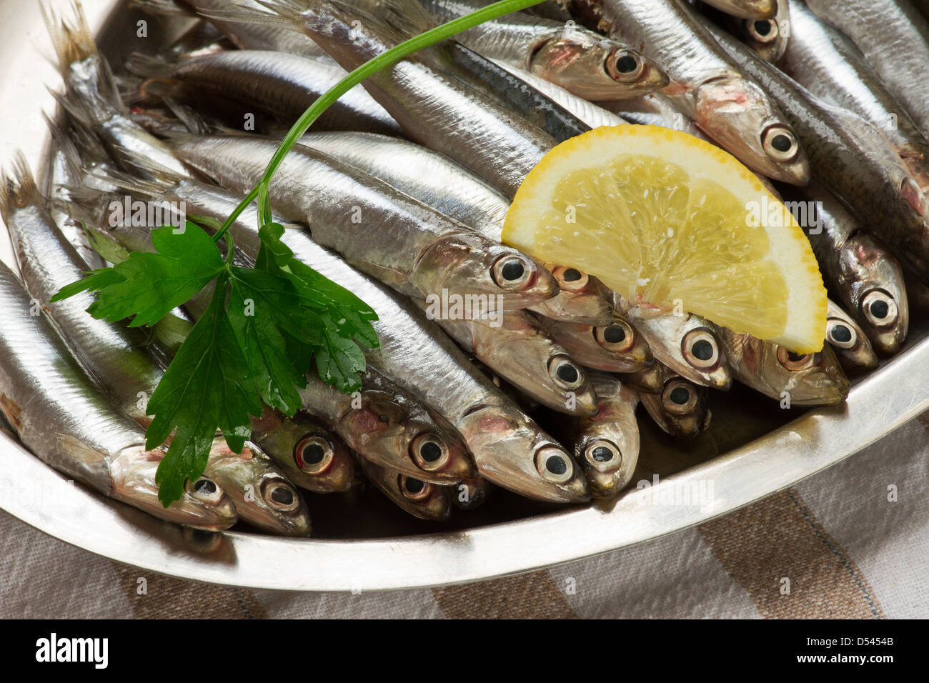 Anchovy.small Mediterranean fish on tray Stock Photo