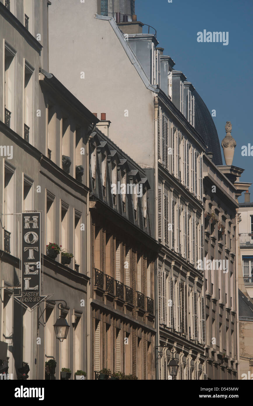 Classic apartment buildings with shutters and balconies in Paris, France Stock Photo