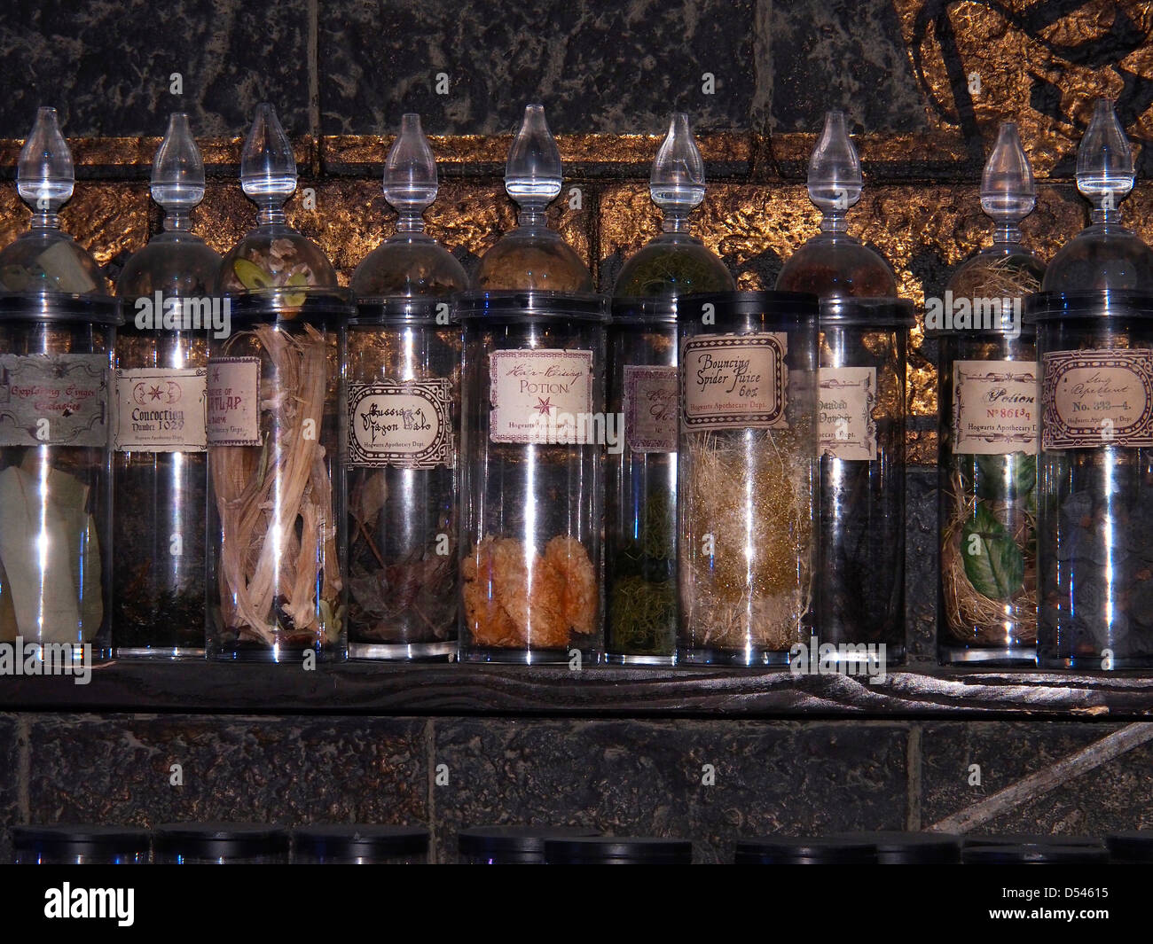Spell bottles on a shelf in a class room set on the the making of Harry