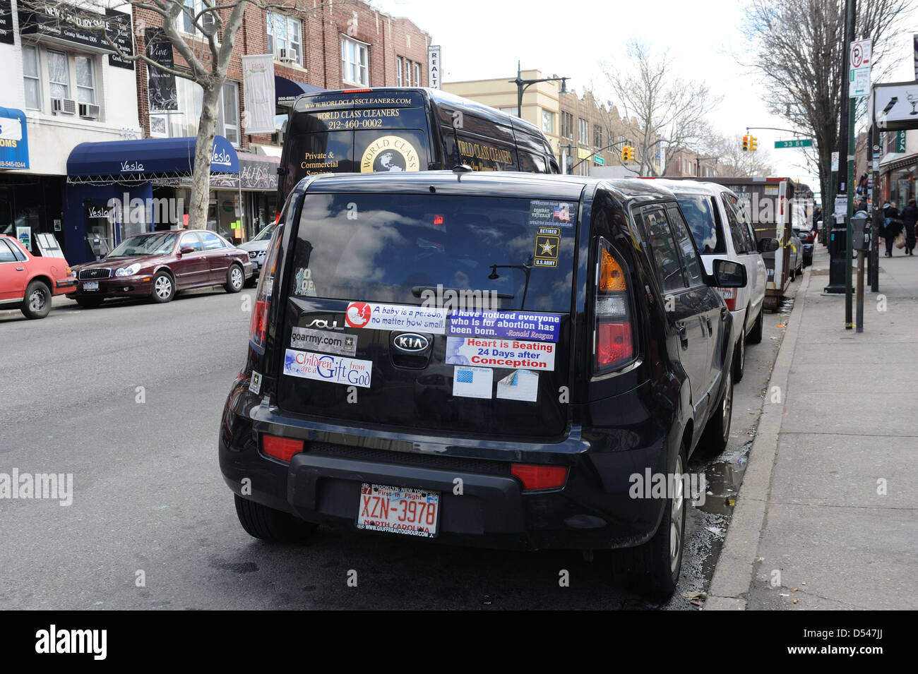A car on a street in Astoria, Queens, plastered with anti-abortion stickers. March 23, 2013 Stock Photo