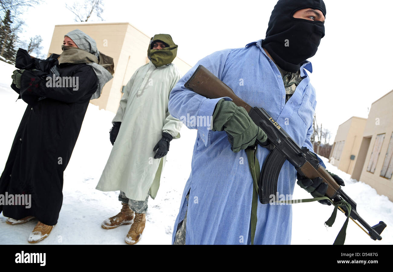 US Army soldiers role play as insurgents during military training February 28, 2013 in Elmendorf, Alaska. Stock Photo