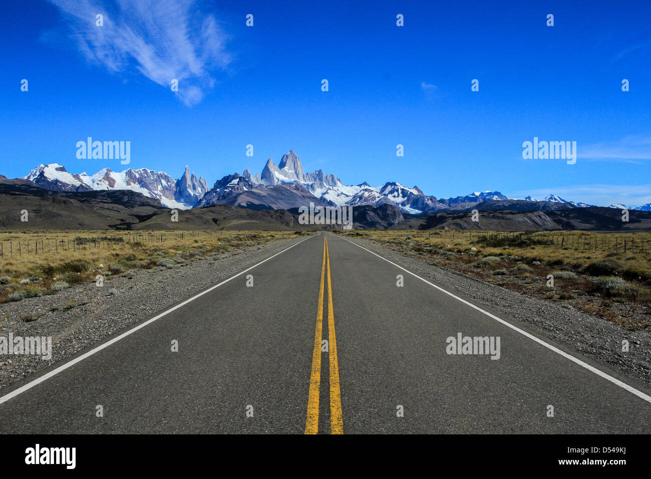 A long road leading to a beautiful Patagonian mountain range. Stock Photo