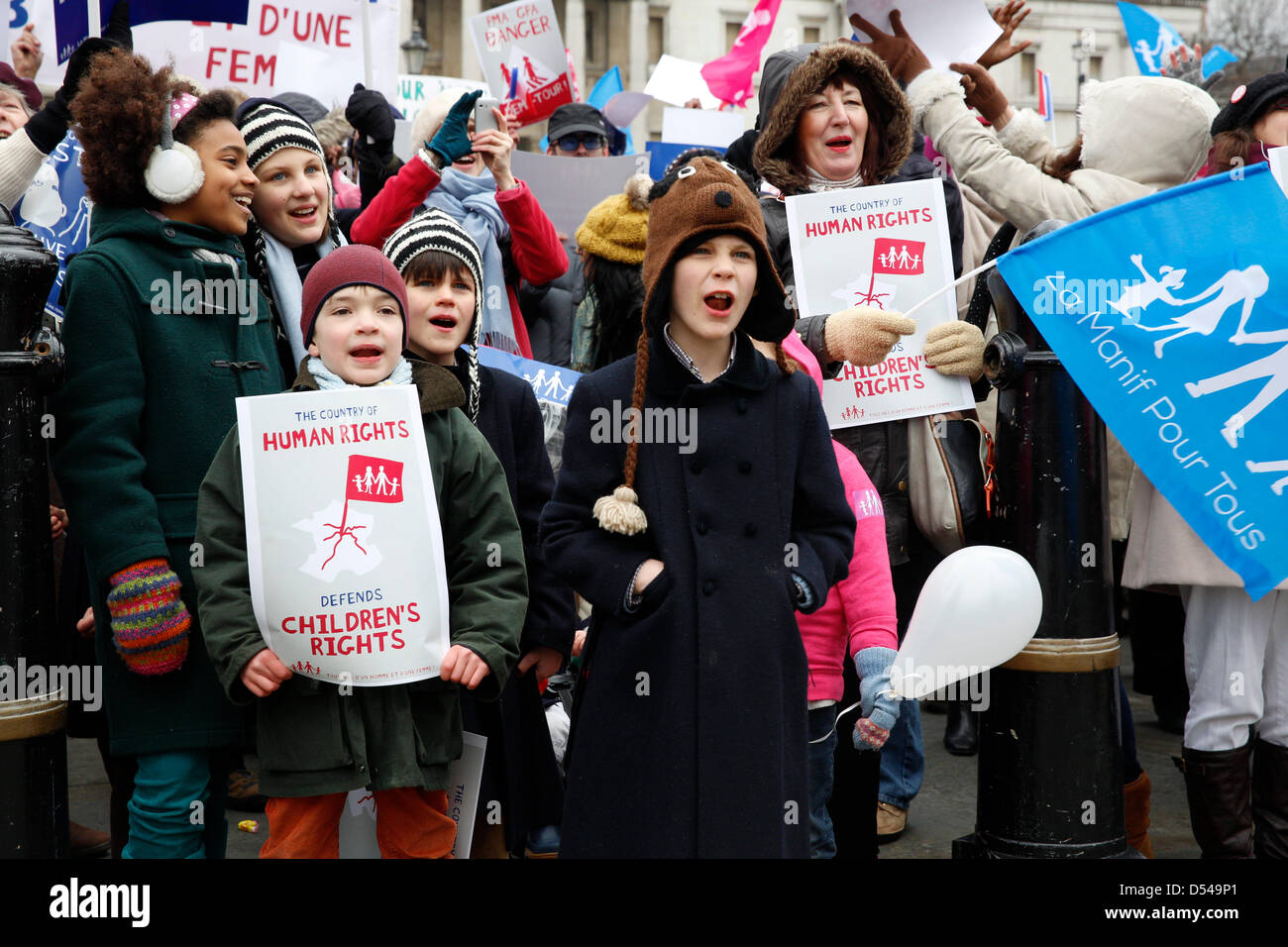 London, UK. 24th March, 2013.  Children and protesters chanting slogans against gay marriage. French protesters alongside religious groups are organising an Anti-Gay rally in Trafalgar Square.  Anglican Mainstream are urging Christians to turn up to protest Stock Photo