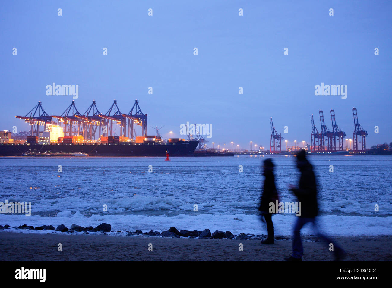 Hamburg, Germany, walkers on the River Elbe and Hamburg harbor in the ...