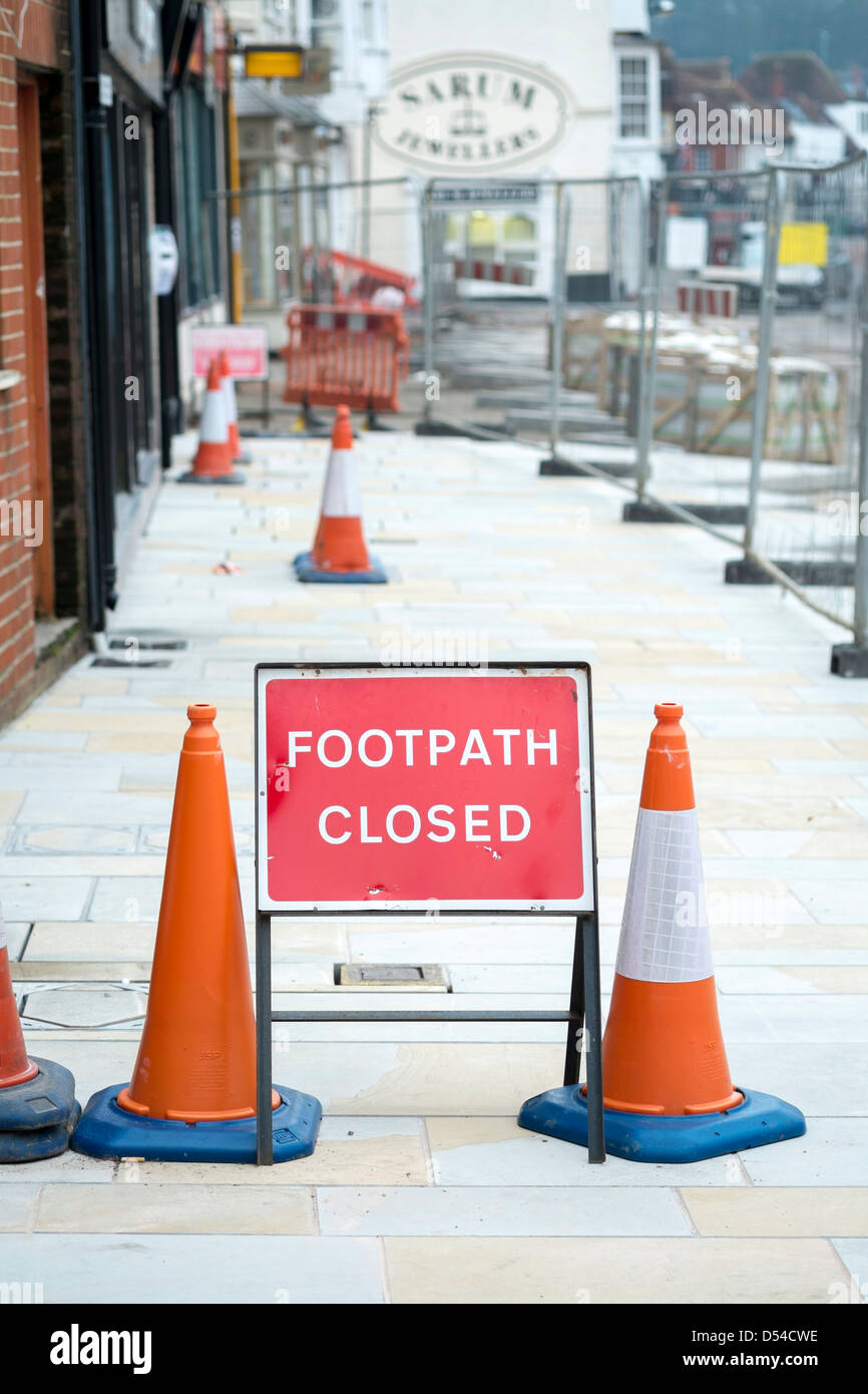 Footpath closed sign and bollard traffic cones Stock Photo - Alamy