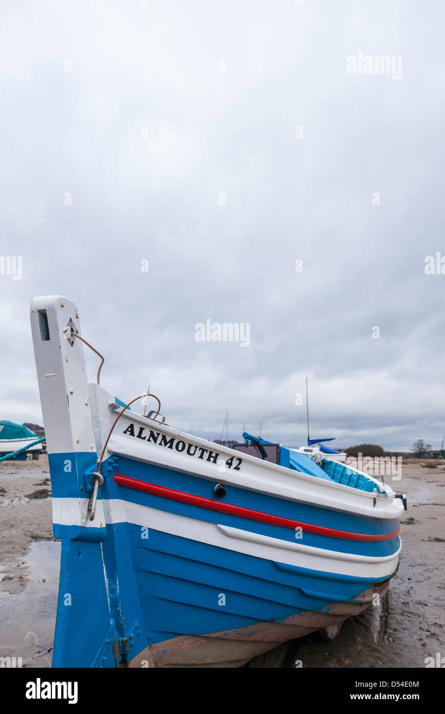 Alnmouth wooden fishing boat moored on the tidal River Aln Estuary ...