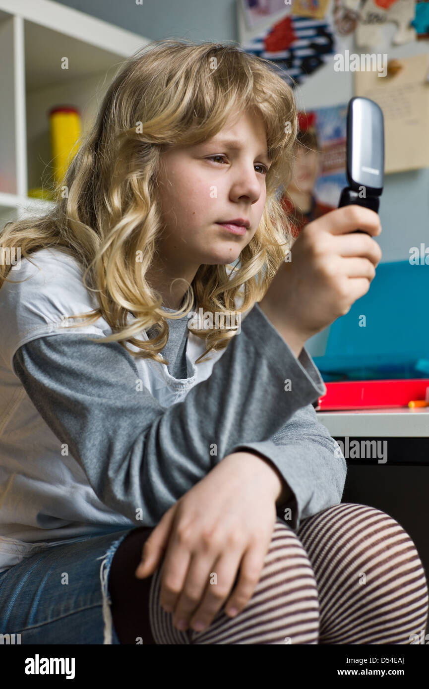 Berlin, Germany, a girl writes SMS Stock Photo