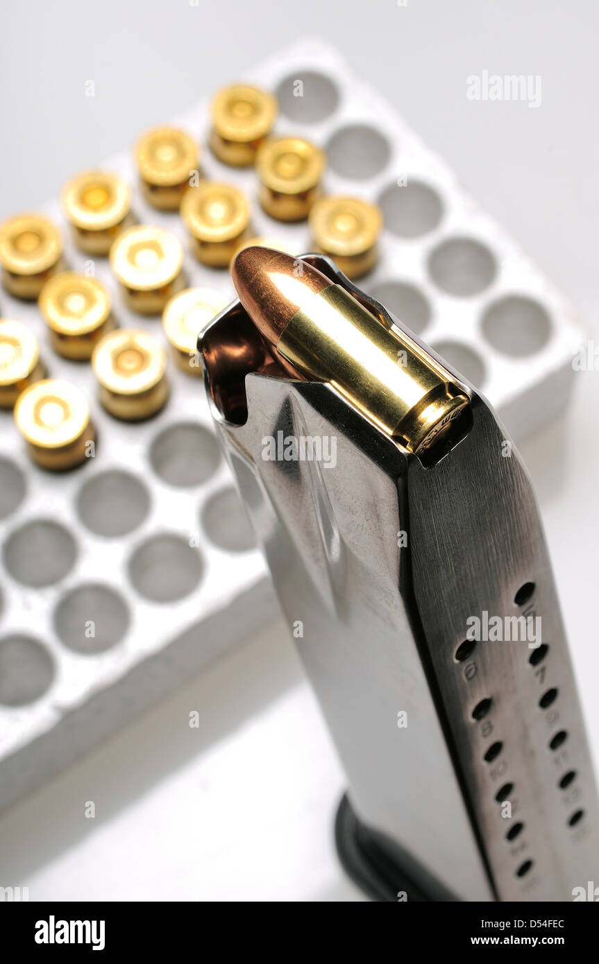 Loaded 9 mm/16 round semiautomatic magazine or clip with box of