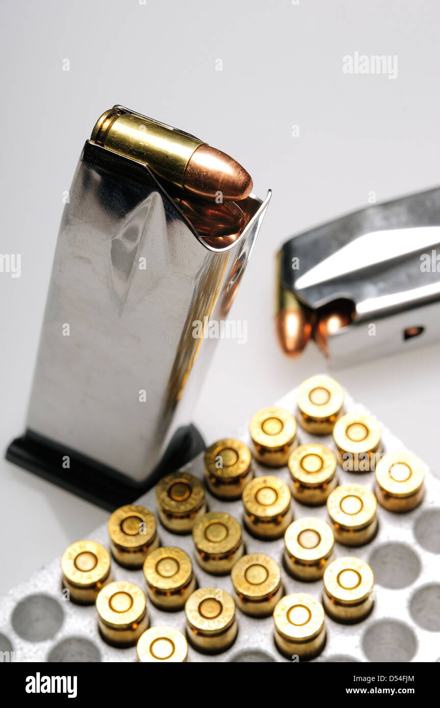 Loaded 9 mm/16 round semiautomatic magazine or clips with box of