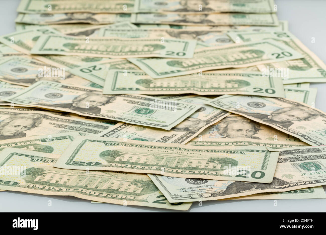 Background image of many twenty dollar bills or notes laid out on table and suitable for composites Stock Photo