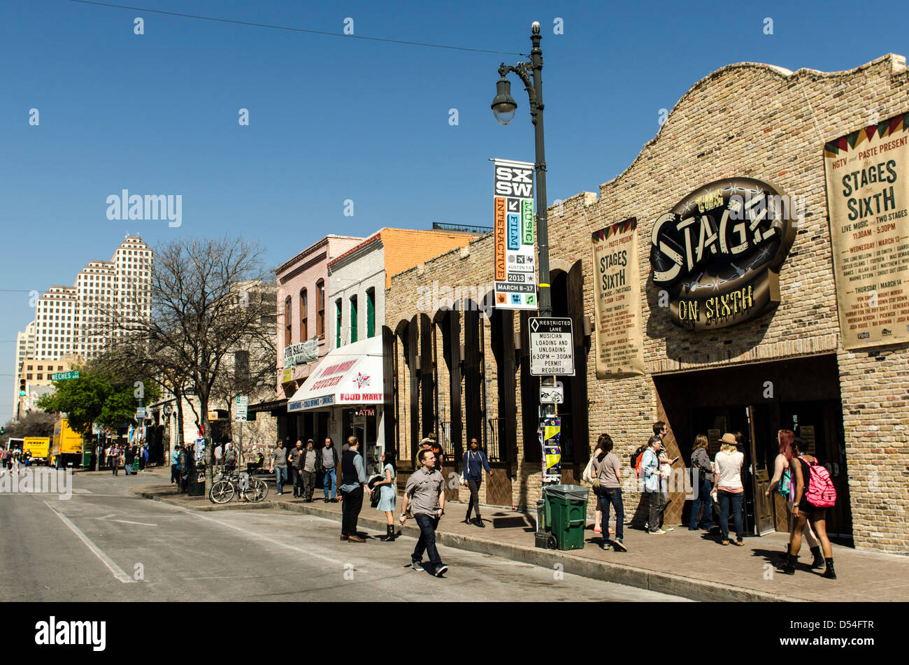 People walking around the 6th Street during SXSW Music festival Austin Texas US Stock Photo
