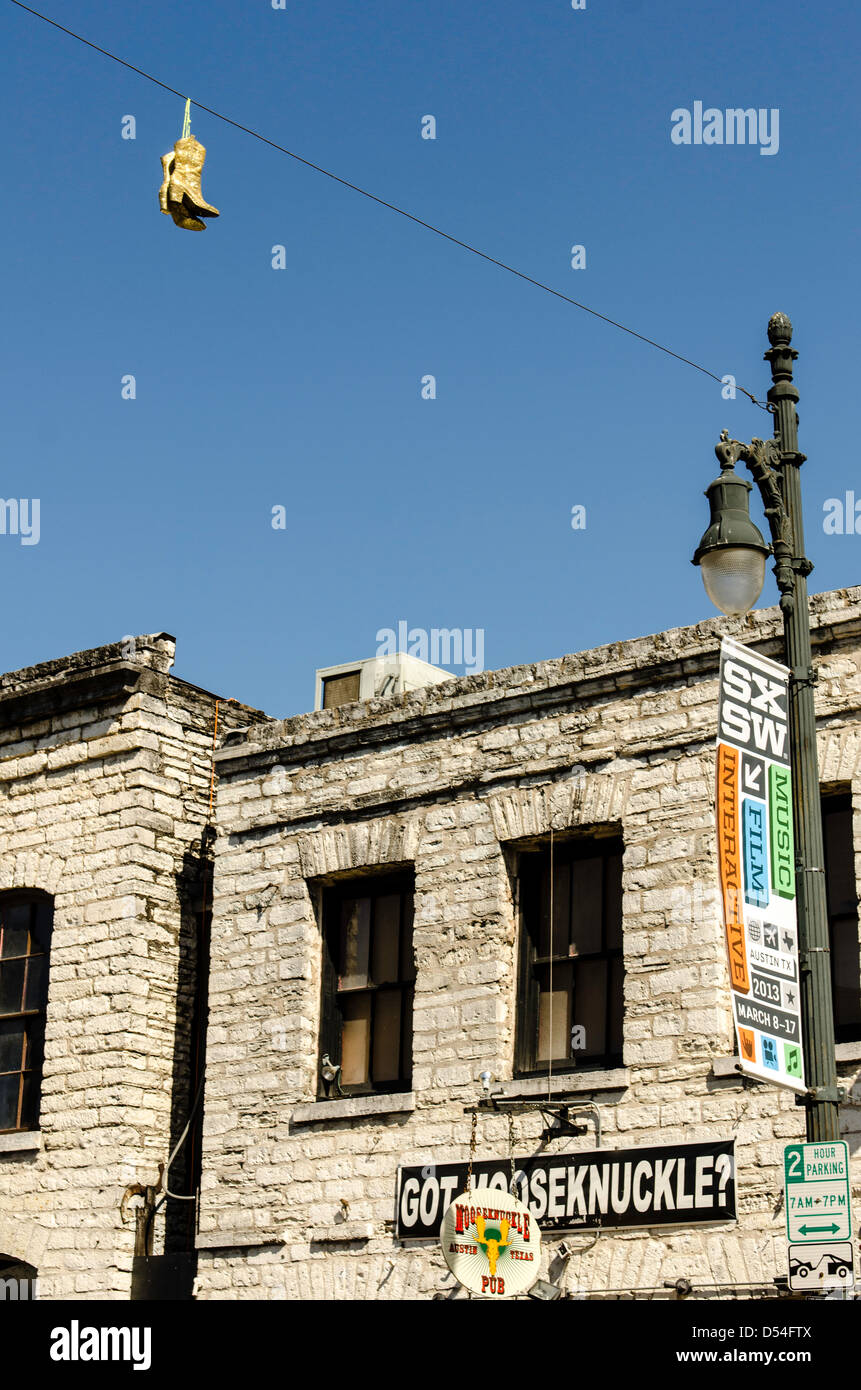 Iconic Texas boot hanging 6th street Austin Texas US Stock Photo - Alamy