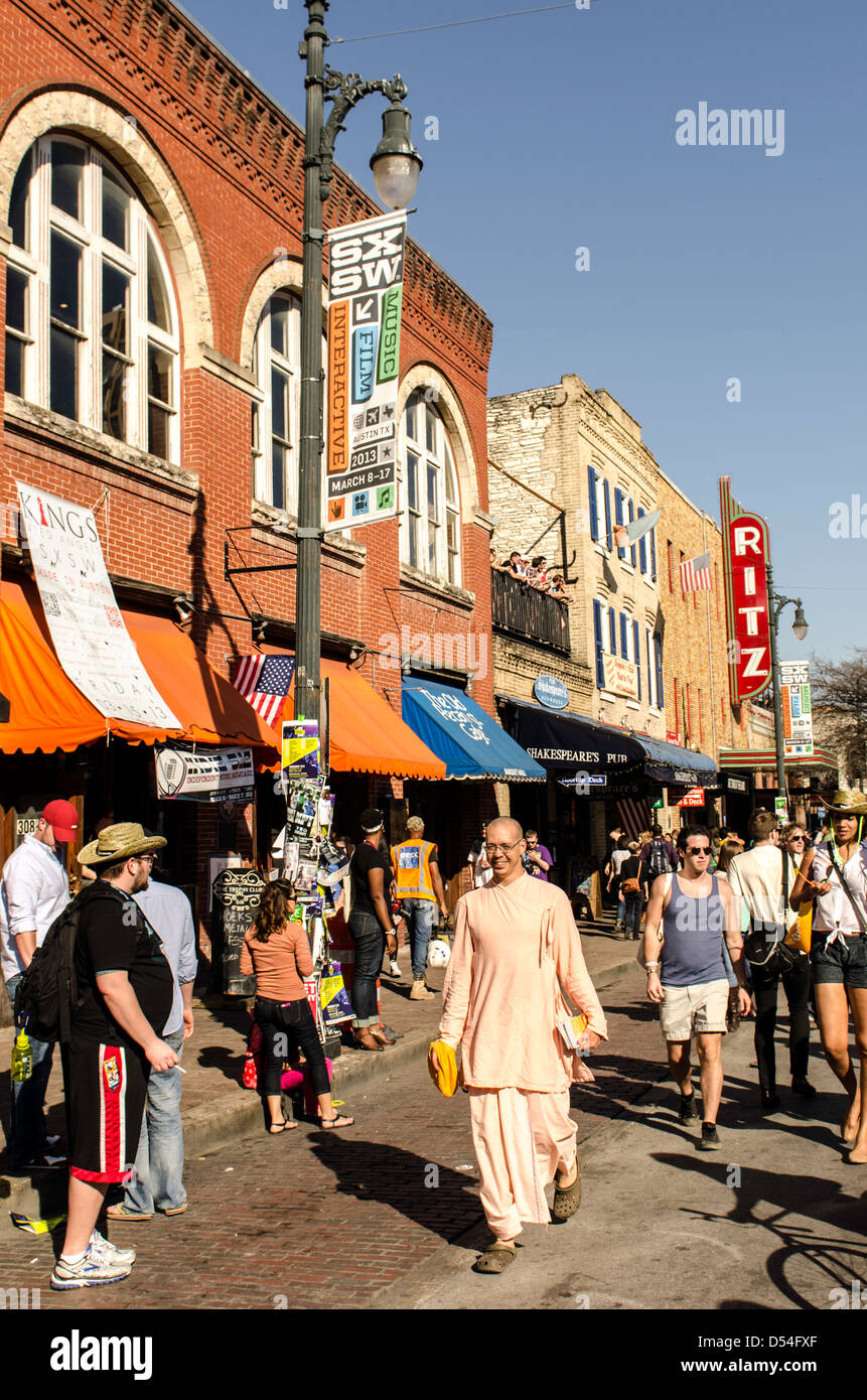 People walking around the 6th Street during SXSW Music festival Austin Texas US Stock Photo