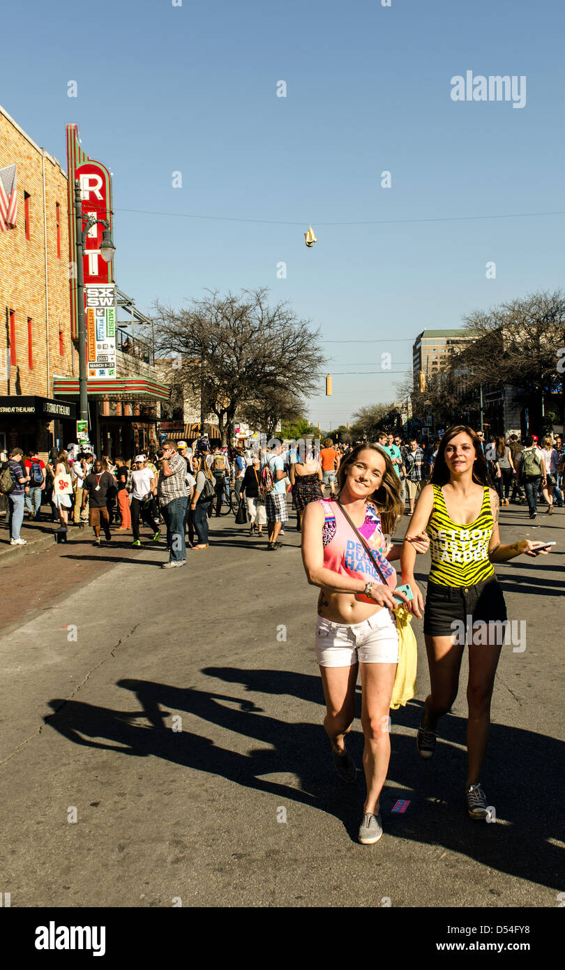 People walking around the 6th Street during SXSW Music festival Austin Texas US Stock Photo