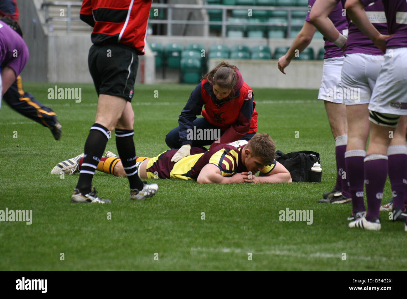 London, UK. 24th March, 2013. An injured Cardiff Met player seen to on the pitch during the men's final of the British Universities & Colleges championships in Twickenham Stadium, London. Stock Photo