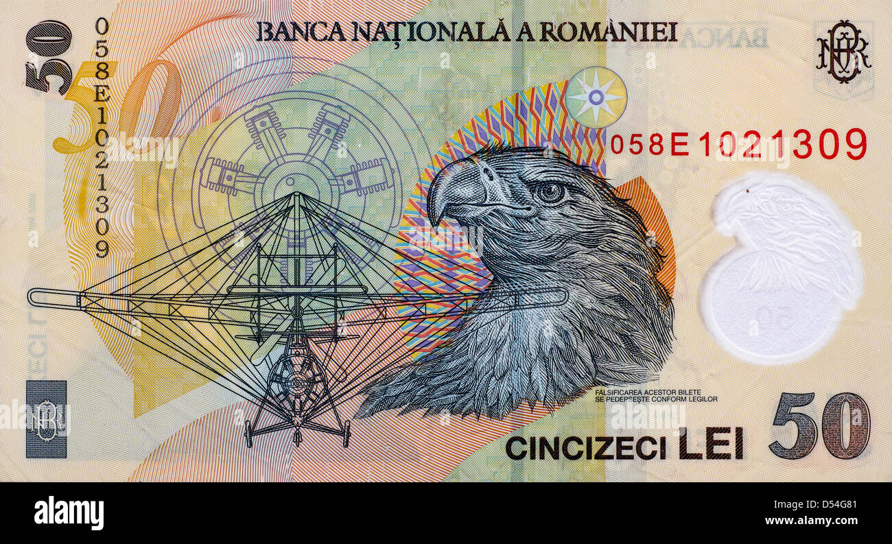 Aurel Vlaicu's plane and an eagle on the back side of a romanian 50 Lei banknote. Stock Photo