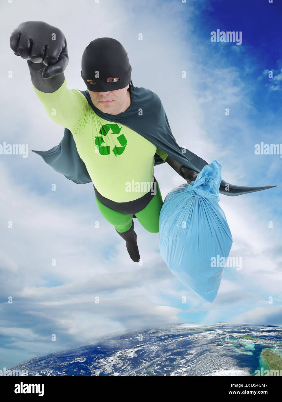 Eco superhero flying away from Earth with bag of trash helping to keep the planet clean Stock Photo