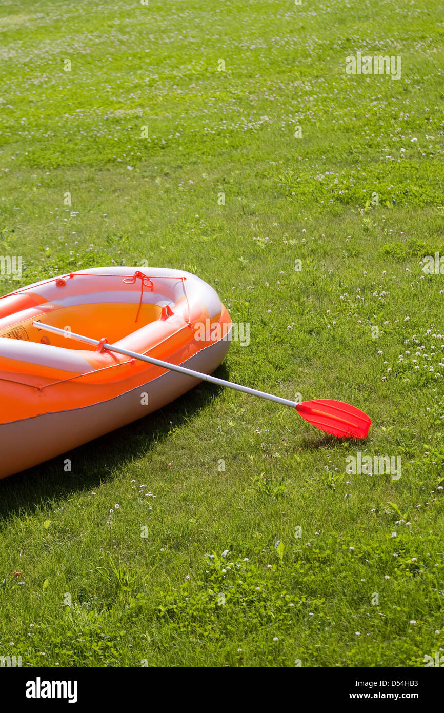 Berlin, Germany, rubber boat lying on a meadow Stock Photo