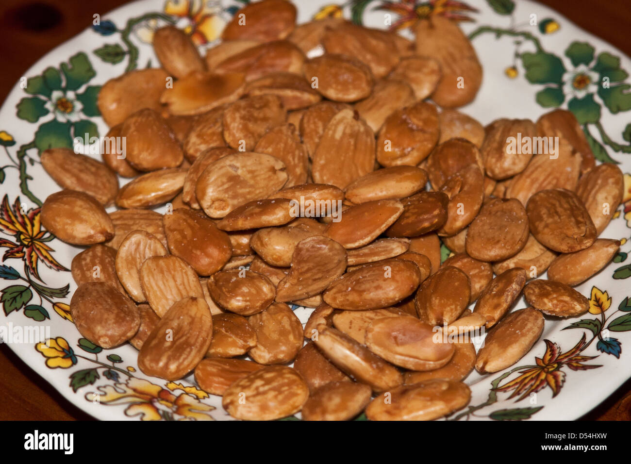 A plate full of freshly roasted Spanish almonds, a traditional snack of