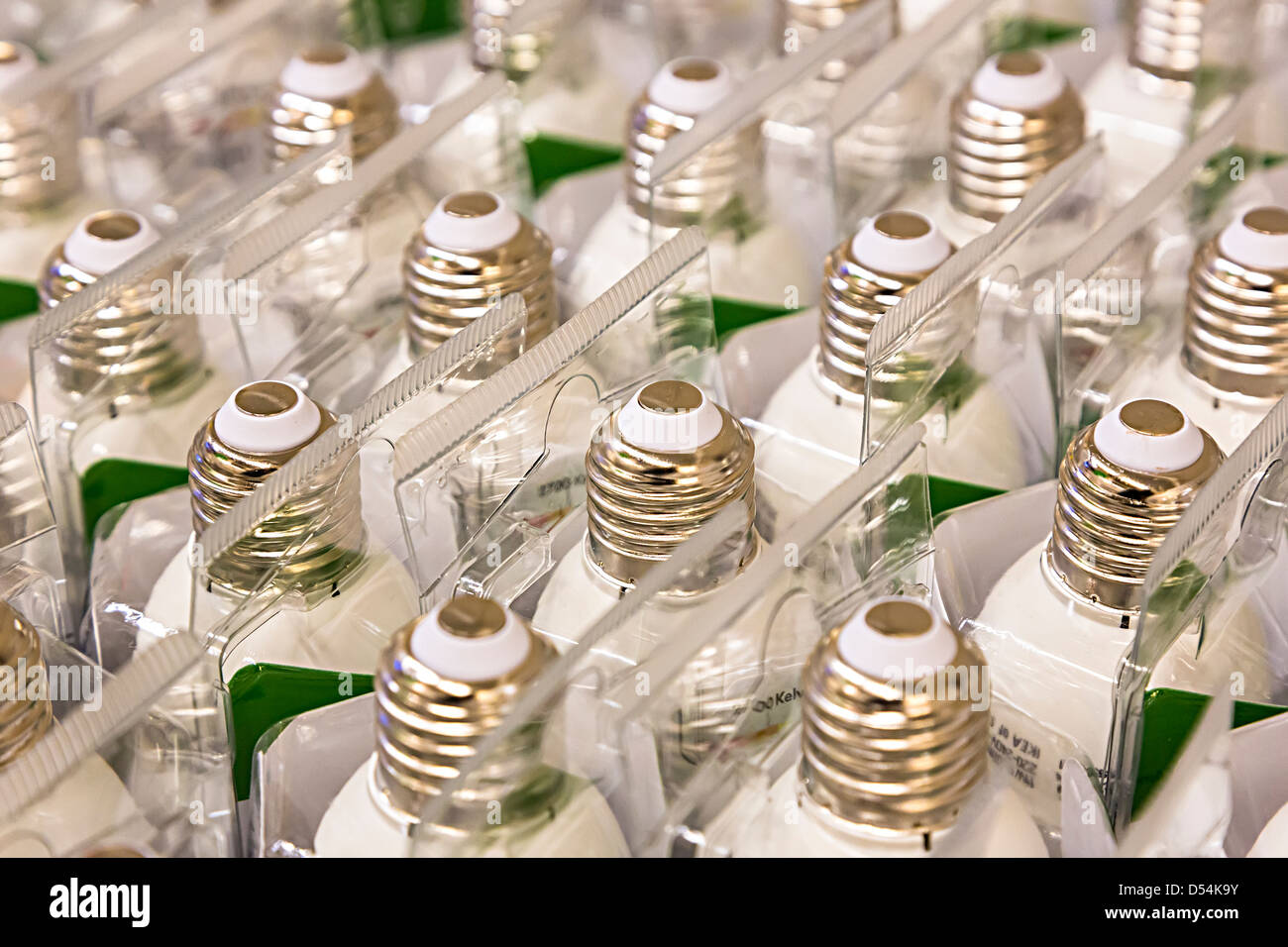 Large Edison screw low energy light bulbs in cartons, UK Stock Photo