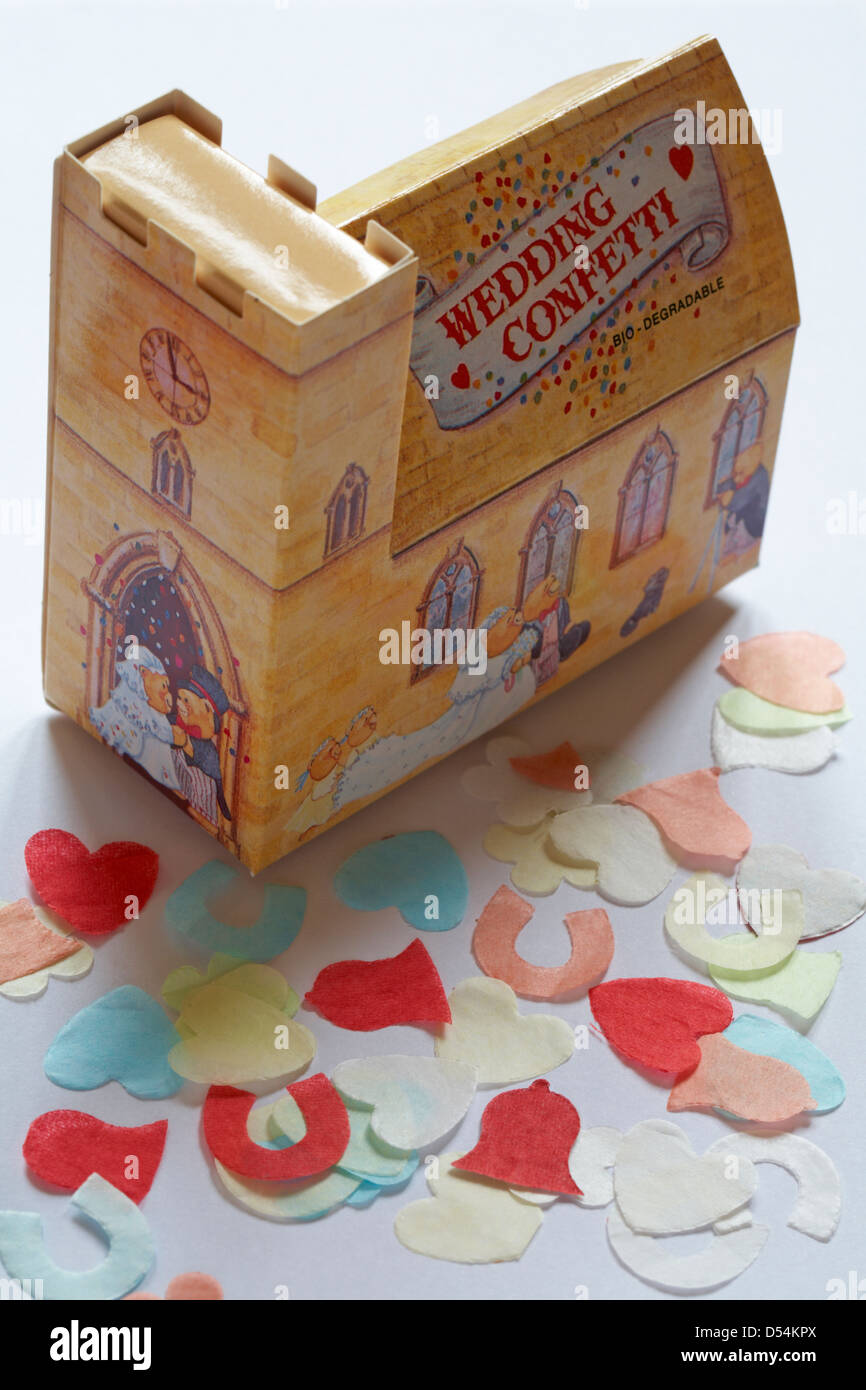 bio-degradable wedding confetti box in shape of church with confetti spread out set on white background Stock Photo