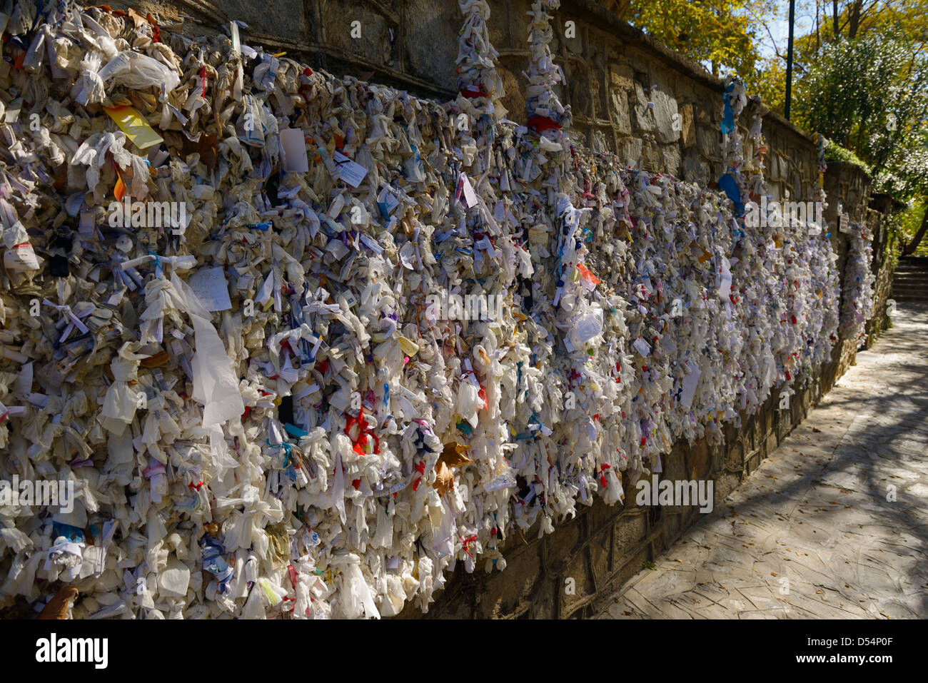 Wishing wall with tied note petitions to the Virgin Mary saint and Mother of God at her restored house near Ephesus Turkey Stock Photo