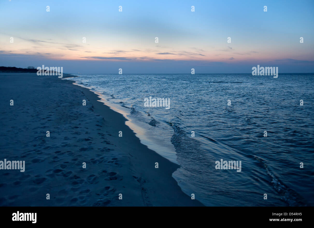 Kuznica, Poland, beach in the dusk of the Gulf of Gdansk Stock Photo ...