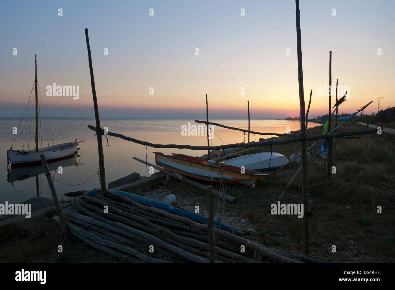 Kiss Field, Poland, sailboat and fishing boats at sunset in the Gulf of Gdansk Stock Photo