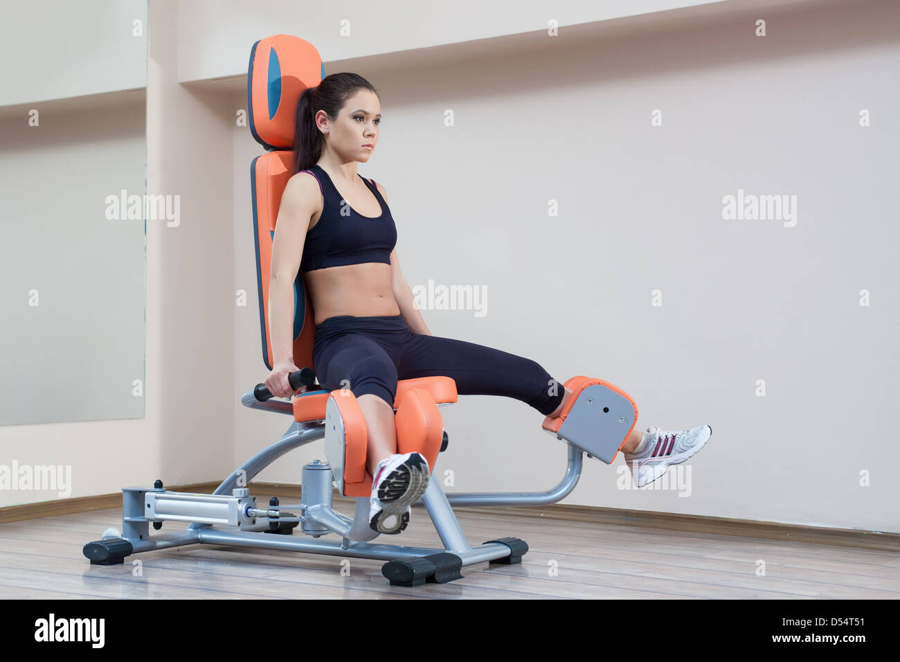 Athletic young woman in gym Stock Photo - Alamy