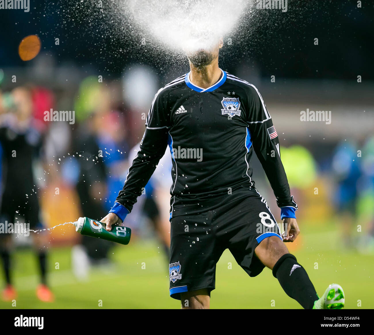 Santa Clara, California, USA. 23rd March 2013. San Jose Earthquakes forward Chris Wondolowski (8) spits out a spray of water just prior to the the MLS game between the Seattle Sounders and the San Jose Earthquakes at Buck Shaw Stadium in Santa Clara CA. San Jose defeated Seattle 1-0. Credit:  Cal Sport Media / Alamy Live News Stock Photo