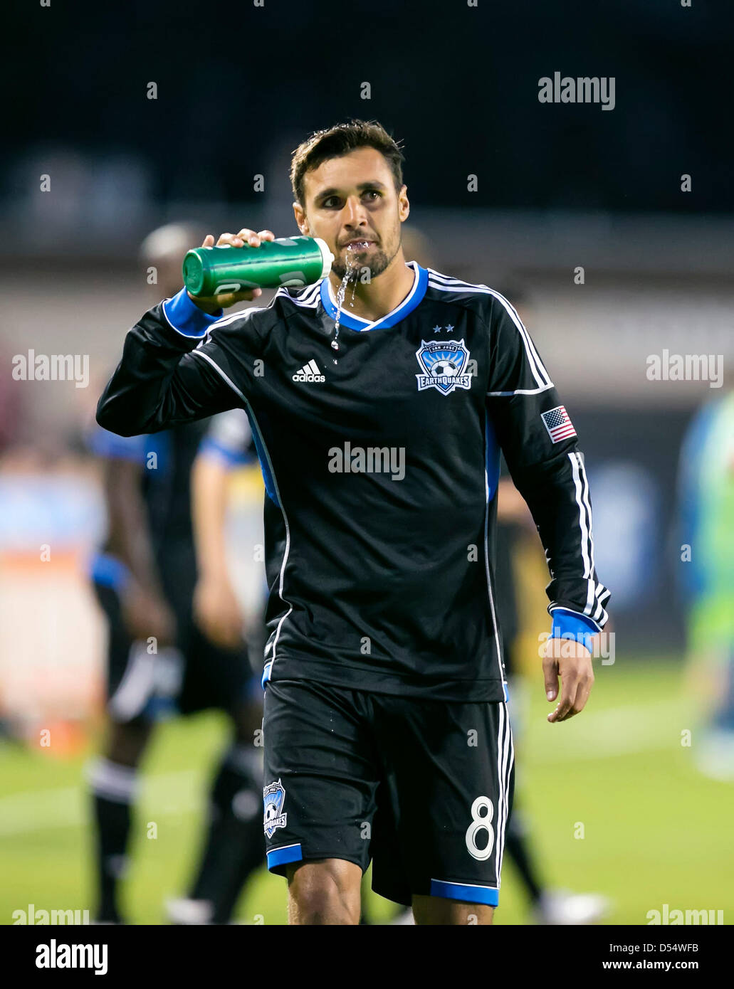 Santa Clara, California, USA. 23rd March 2013. San Jose Earthquakes forward Chris Wondolowski (8) spits out a spray of water just prior to the the MLS game between the Seattle Sounders and the San Jose Earthquakes at Buck Shaw Stadium in Santa Clara CA. San Jose defeated Seattle 1-0. Credit:  Cal Sport Media / Alamy Live News Stock Photo