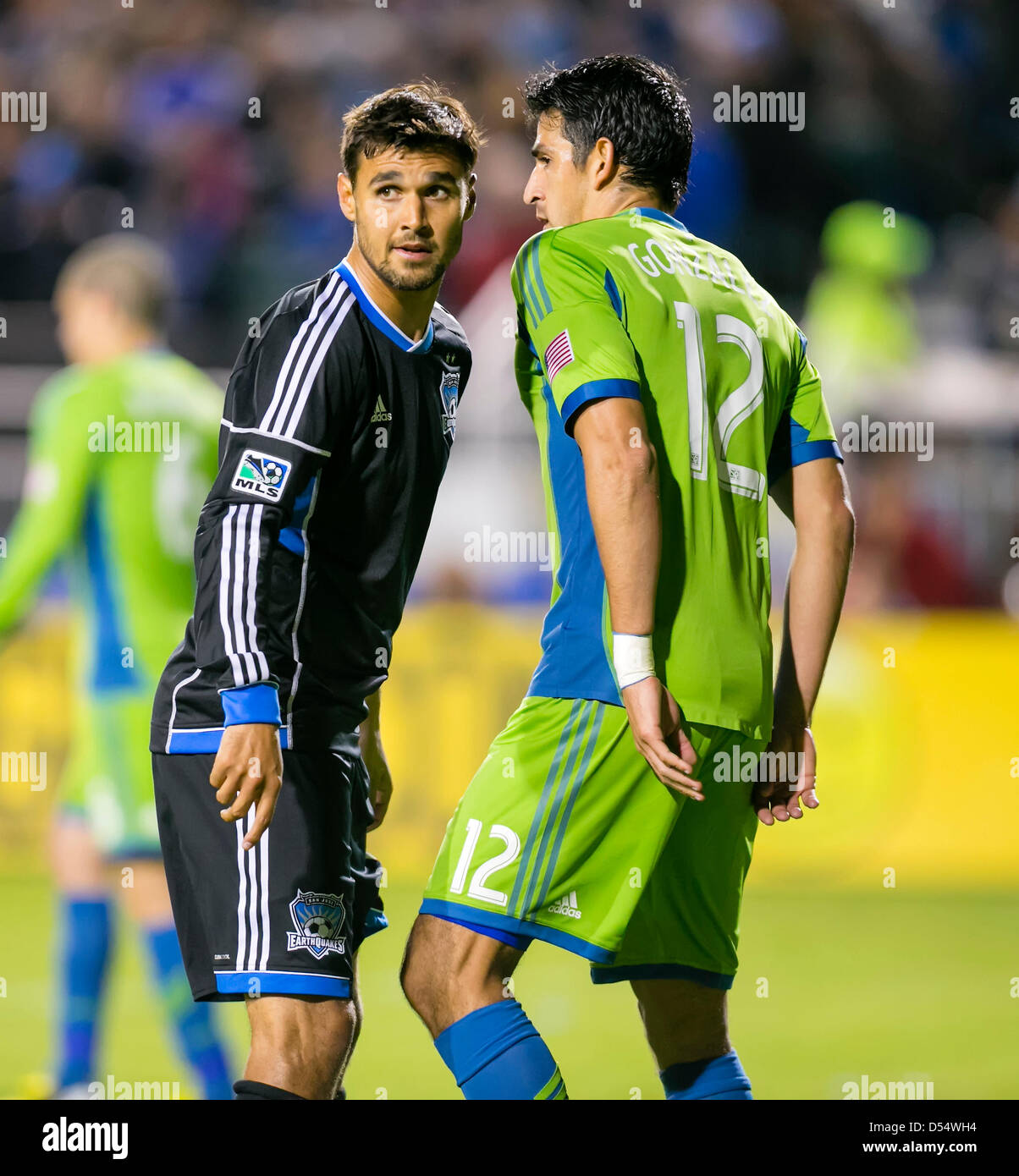 Santa Clara, California, USA. 23rd March 2013. Seattle Sounders defender Leo Gonzales (12) squares up with San Jose Earthquakes forward Chris Wondolowski (8) during the the MLS game between the Seattle Sounders and the San Jose Earthquakes at Buck Shaw Stadium in Santa Clara CA. San Jose defeated Seattle 1-0. Credit:  Cal Sport Media / Alamy Live News Stock Photo
