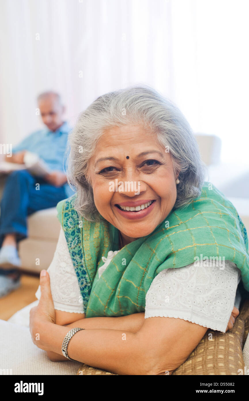 Woman reading smiling home hi-res stock photography and images - Alamy
