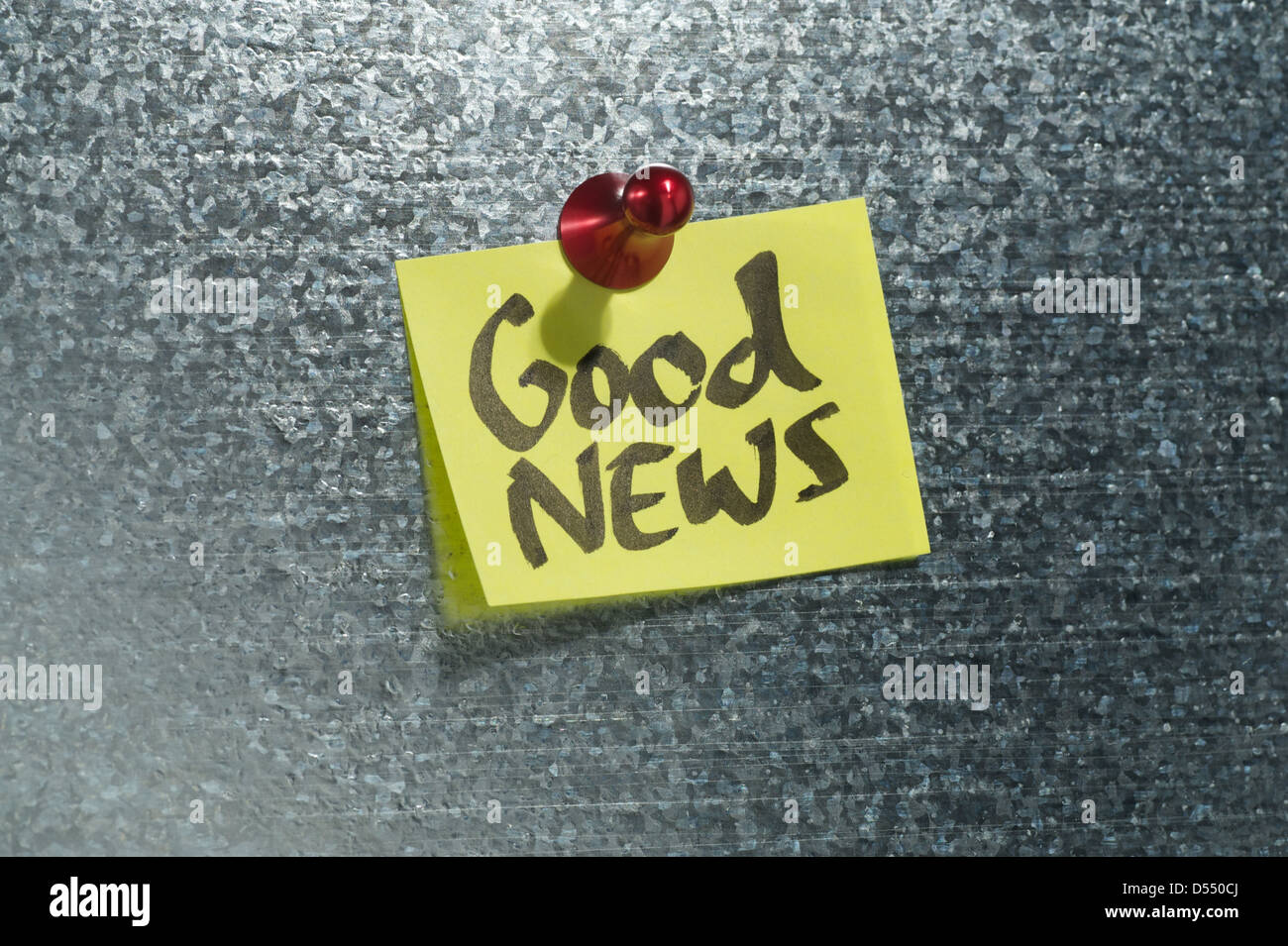 Hamburg, Germany, notes with the words Good News depends on a magnetic wall Stock Photo
