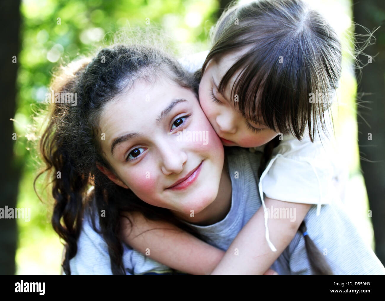 Portrait of beautiful young girls in the park Stock Photo - Alamy