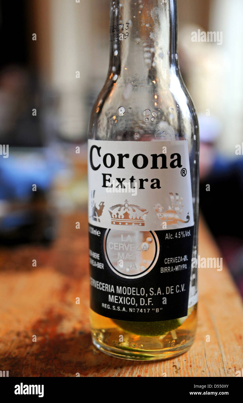 Half drunk bottle of Corona Extra lager style beer in a pub Stock Photo