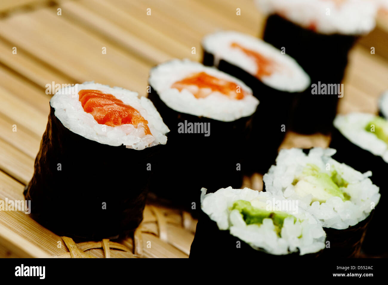 https://c8.alamy.com/comp/D552AC/rolled-sushi-on-a-bamboo-tray-D552AC.jpg