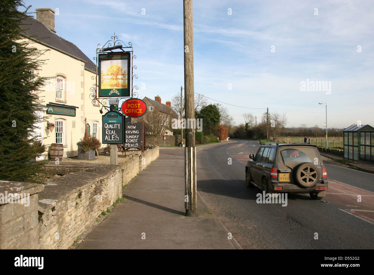 The Wheatsheaf Inn in the village of Crudwell, Wilts UK, pub with a post office Stock Photo