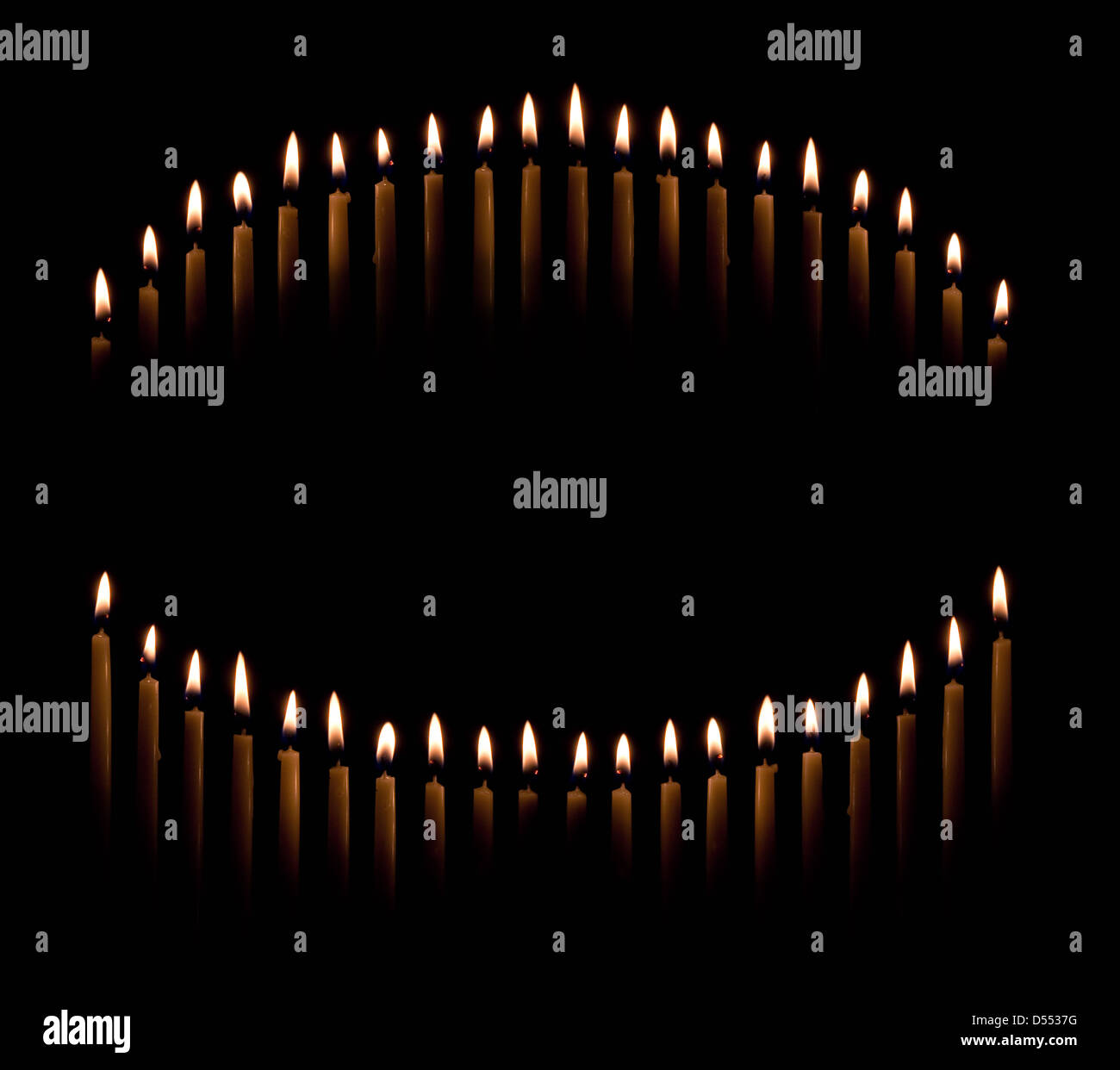 Group of tapered candles form a candle light circle or curve Stock Photo Alamy